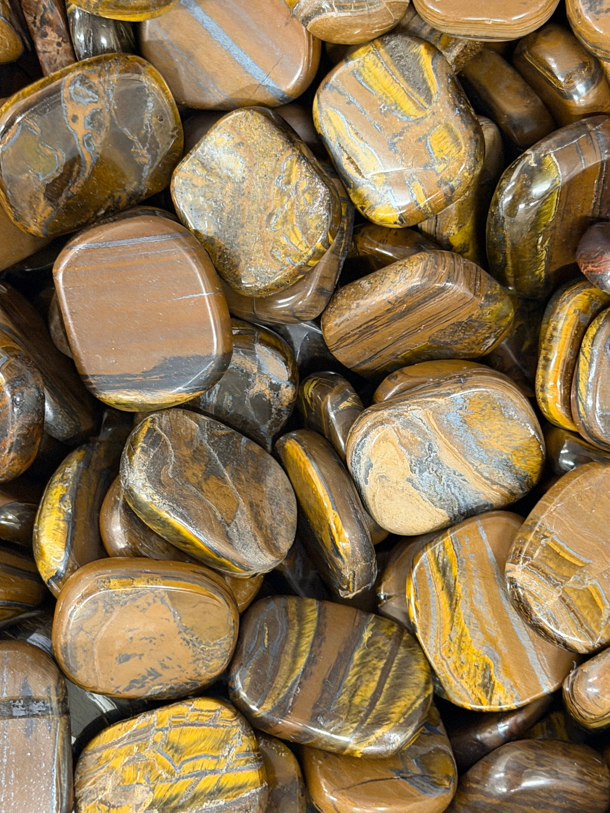 Tiger Iron Oval Pocket Stone Medium